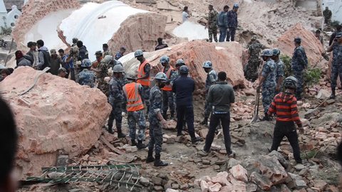 KATHMANDU, NEPAL - APRIL 26, 2015: Nepal Armed Police Force, army, police and civilians start rescue efforts at the collapsed Dharhara tower after the 7.8 earthquake on 25 April 2015.