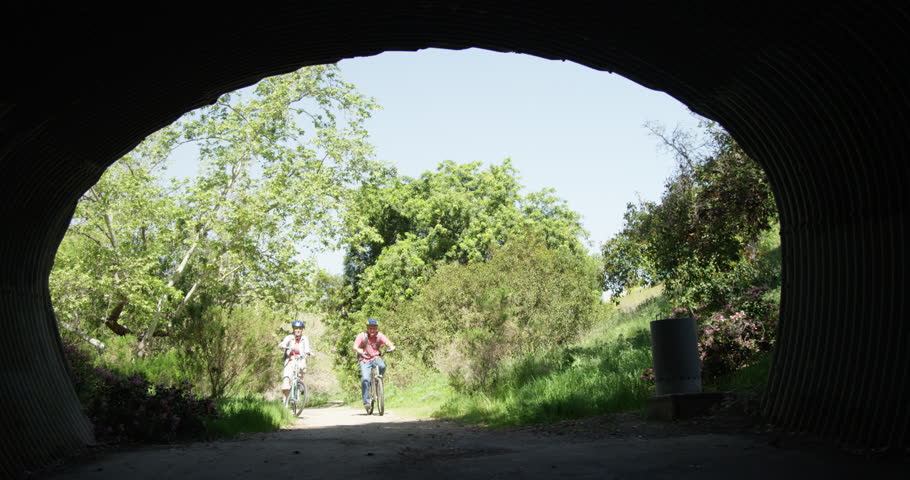 Active senior couple riding bikes on trail