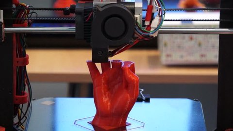 3D printer at work, 3D printer print the human hand, 3D printer print the red human hand, Hand Shape Product Printed With 3d Printer