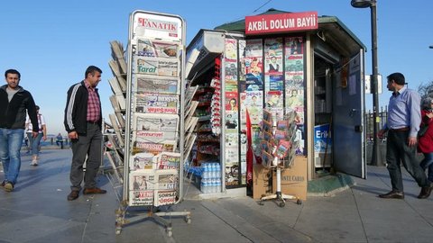 ISTANBUL - APR 27, 2015: Newspapers and magazines on display at a newsstand at Eminonu Square. Certain words are used very often in local newspaper headlines because they are short or sound dramatic