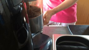 Barista presses the coffee for espresso-Dolly shot, stock video