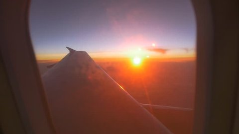 Airplane window view at sunset, Zoom shot