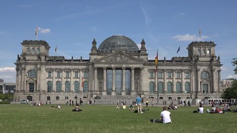 BERLIN- GERMANY, JULY 3, 2014, ULTRA HD 4K Tourist people relax in Republic square in front of Bundestag building by day 