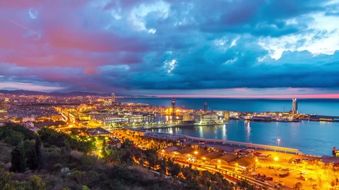 Aerial view timelapse (time lapse, time-lapse) of Barcelona city sunrise from Montjuic mountain mirador, Spain. September 2013.
