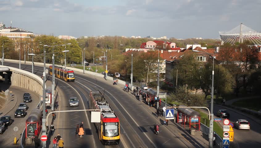 Skyline of Warsaw, traffic, trams, cars, buses, passengers, commuters, Poland