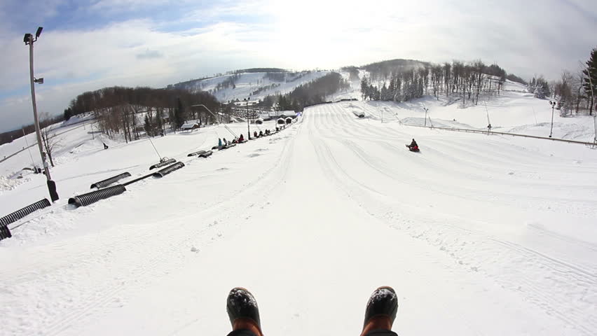 Riding down a snow tubing hill.  Rider's point of view.