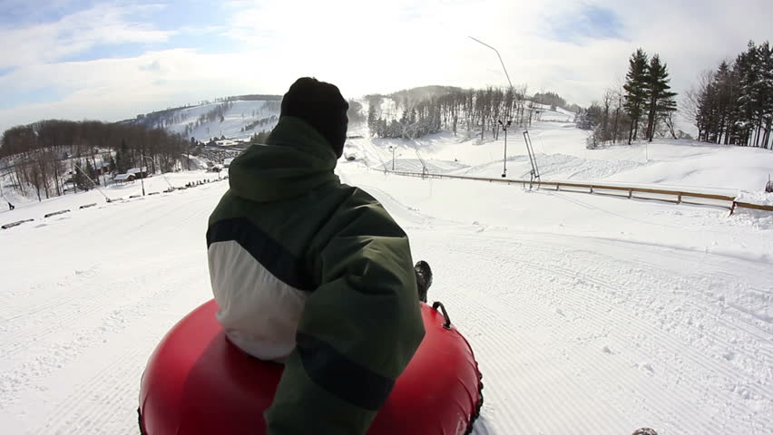 Riding down a snow tubing hill.  Rider's point of view.