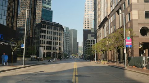 An empty street in downtown Pittsburgh, PA. Can be used as an abandoned, shelter-in-place, quarantine, social distancing concept. Perhaps during a pandemic COVID-19/Coronavirus. 	