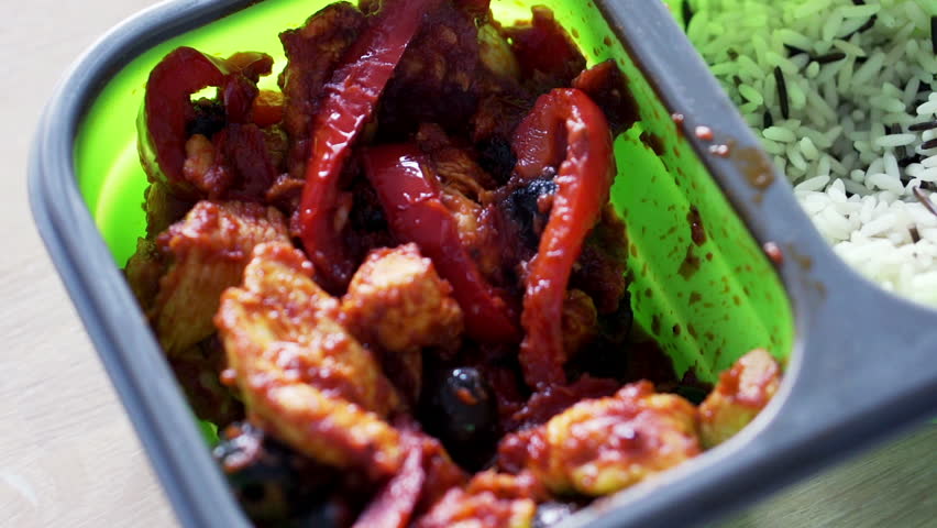 Rice with tasty chicken in lunch box
