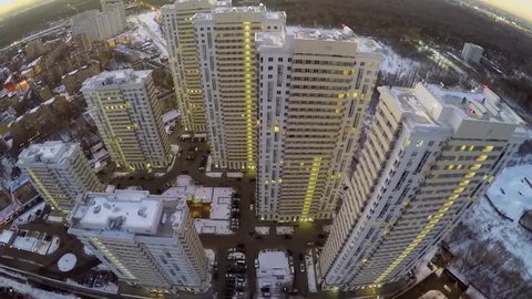 Illuminated residential complex on Elk Island in Moscow at winter evening. Aerial view