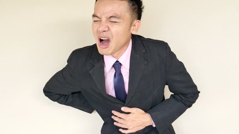 businessman suffering from stomach ache, indigestion