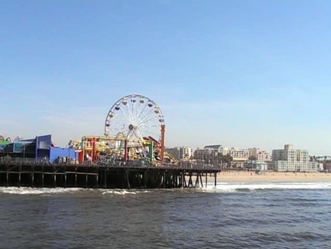 Ferris wheel turning on Santa Monica pier Los Angeles