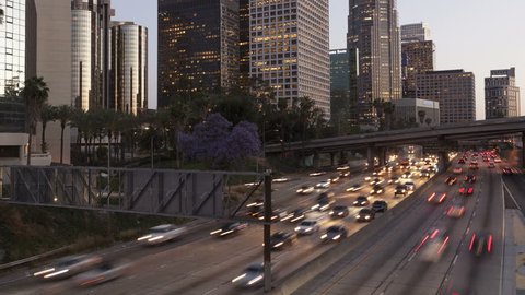 LOS ANGELES, CA, USA - APR 15, 2015: 4K Time lapse of traffic in Downtown Los Angeles at twilight with light trails