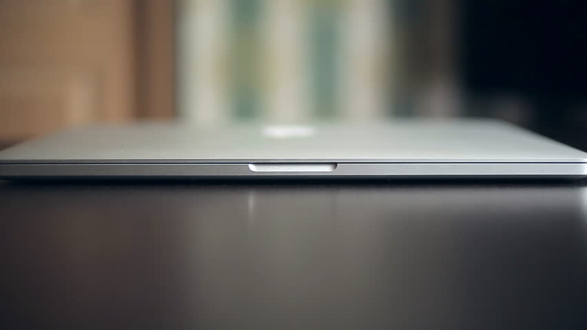 Hand open modern laptop