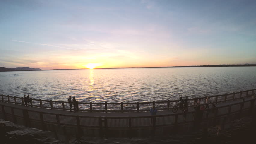 Bike Wheelie by a man at sunset at Boulevard Park in Bellingham, Washington