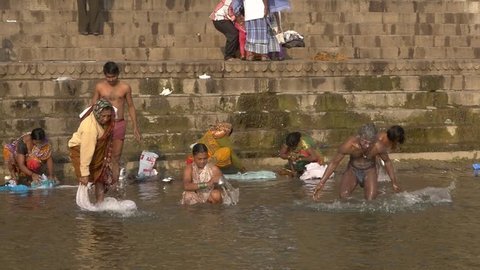 India, varanasi, people bathing in ganges river, february 2015. Varanasi is the spiritual capital of India.