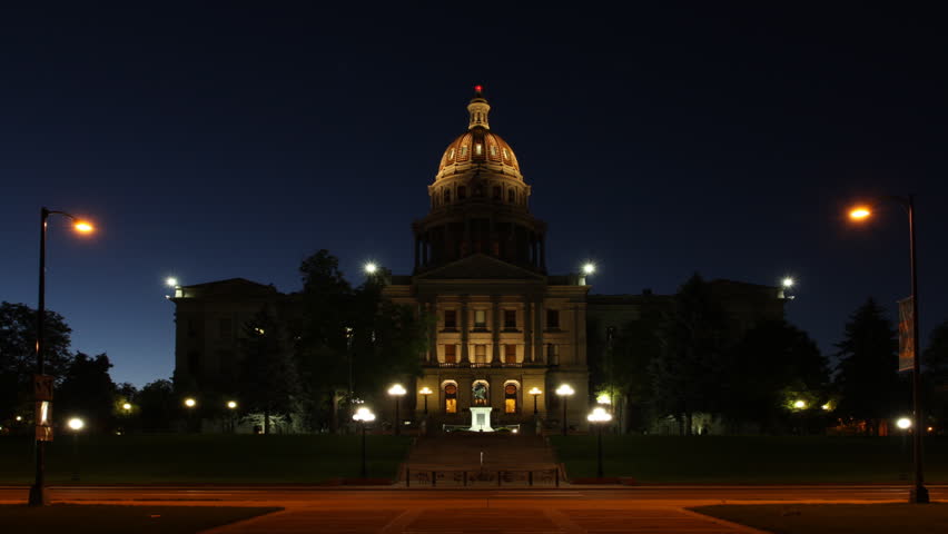 The sun comes up behind the Colorado State Capitol Building in Denver. HD 1080p