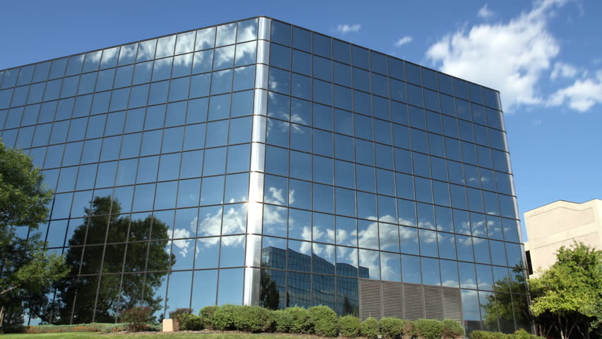 Clouds reflected in the windows of a corporate office building in Denver. HD