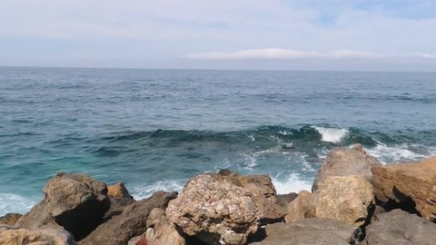 Serene Blue Sea, Waves Braking Into Rocks