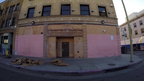 LOS ANGELES CALIFORNIA, USA - May 2, 2015: Gritty buildings and sidewalk tents in downtown Los Angeles's skid row neighborhood. 