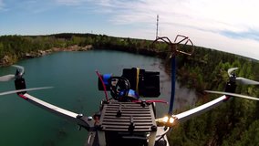 Drone in flight over  lake in canyon and  wood. POV clip
