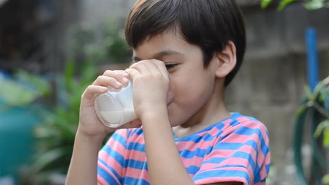 Little boy drinking milk 