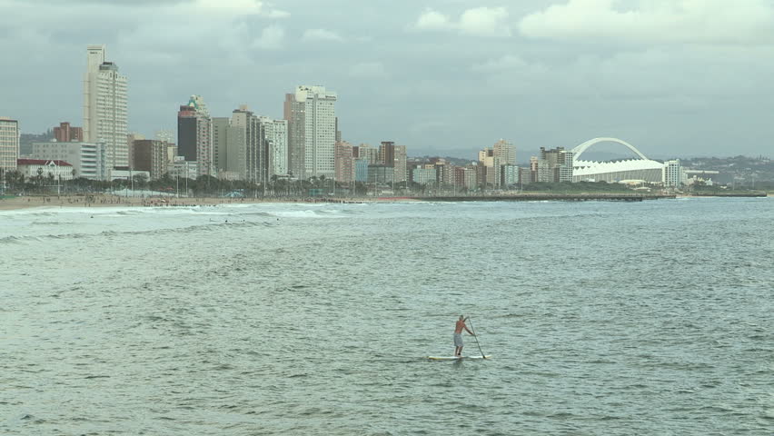 Man paddle-boarding off Durban's beachfront