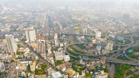 Video 1080p - Downtown cityscape of Bangkok. Thailand's capital city. on a smoggy. hazy day. with a major highway junction from an elevated position.