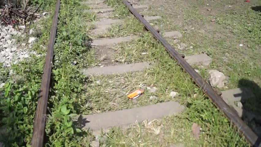 SAN PABLO CITY, LAGUNA, PHILIPPINES - NOVEMBER 5, 2012: view of railroad tracks from a moving trolley cart