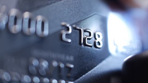 Credit Card swipe through PIN Terminal. Extreme closeup. Shallow depth of field. Close up