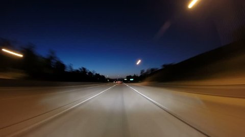 Driving twilight time lapse on the 118 and 405 Freeways in the San Fernando Valley area of Los Angeles. 