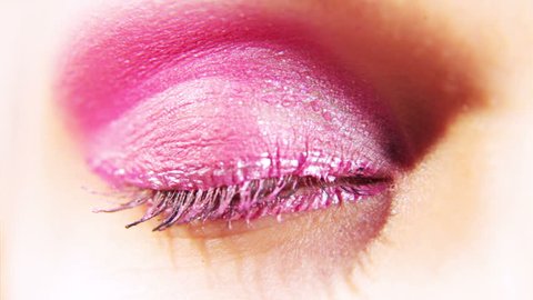 close-up of an eye with heavy make-up opening Stock video