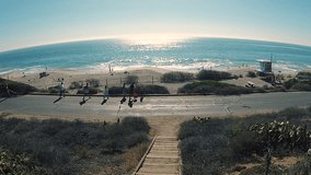 AERIAL VIDEO OF FAMILY WALKING TO THE BEACH
