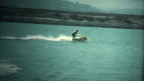 (Super 8 Vintage) Original Jetski Turning Wipeout.  A retro super 8mm reel-to-reel home movie film professional clean and captured in full 4k (3840x2160 UHD) resolution plus footage restoration.