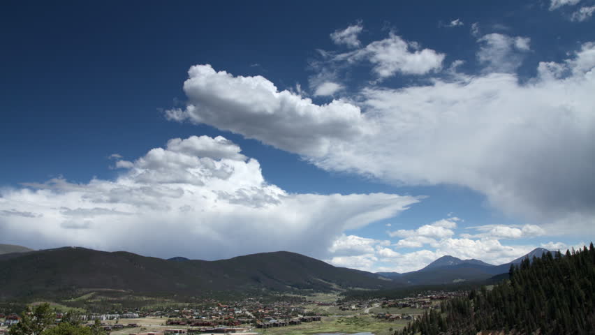 Clouds move over a town in the Rocky Mountains of Colorado.