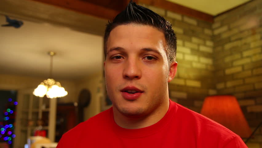 A young man talks directly to camera.  Great for use on a screen for a video