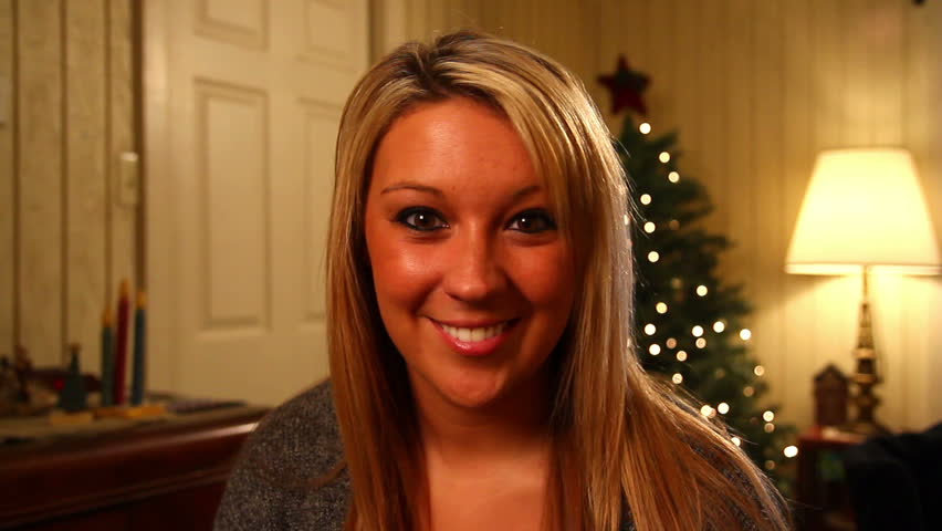 A young woman talks directly to camera.  Great for use on a screen for a video
