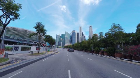 SINGAPORE - CIRCA APRIL 2015: POV, driving to business district Raffles Place.