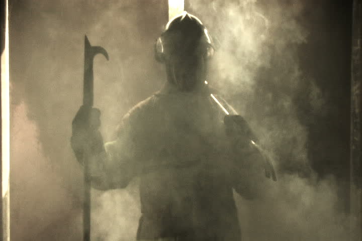 Firefighter with billowing smoke