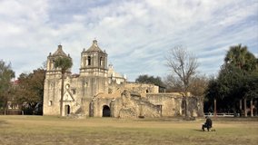 Video of the old Spanish Mission Concepcion in San Antonio, Texas with artist painting building. Built in early 1700s by missionaries from Spain. 