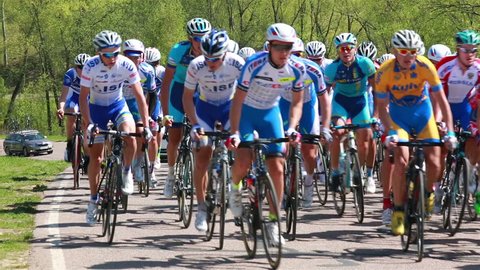 MOSCOW, RUSSIA - APRIL 08, 2015: Bicycle Race. A group of cyclists overcomes the rise.