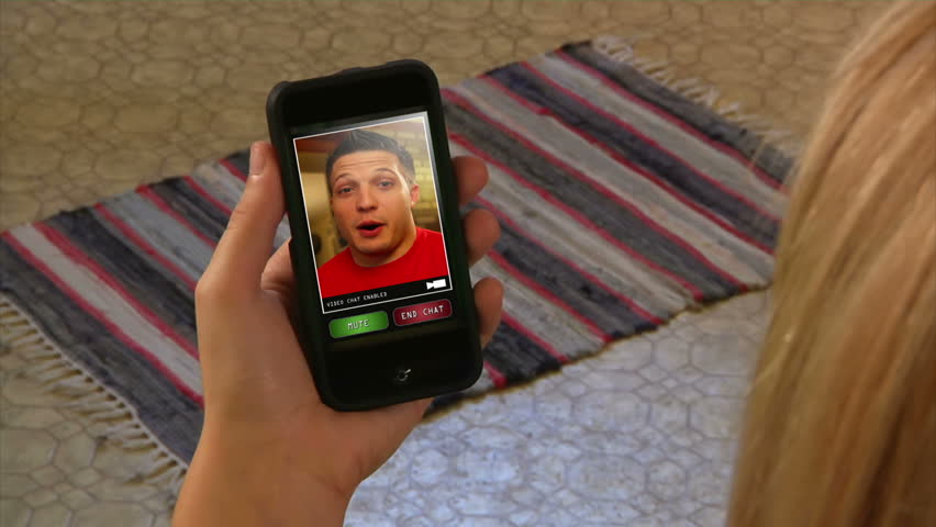 Male video chatting on a generic, portable handheld device.  Screen images