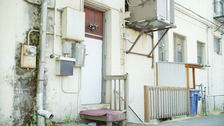 The back entrance of an urban apartment building