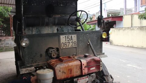 HAI DUONG, VIETNAM, April, 12;  a mechanic repairing motor cars oto on April 12, 2015 in Hai Duong, Vietnam