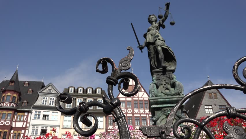ULTRA HD 4K Lady Justice statue in Romer public square, Frankfurt landmark by day