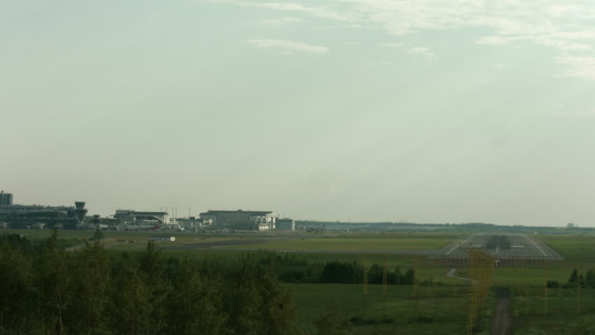 Timelapse from Helsinki-Vantaa airport. Wide shot with planes taxing and taking off.