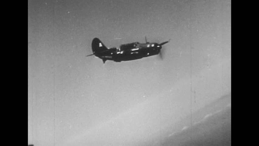 UNITED STATES 1940s: Plane launches missiles / Aerial view, bombs drop on water / Ship fires missiles / Bombs explode on ground, smoke plumes.