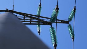 Stock video insulators on poles high-voltage line on a background of blue sky afternoon - Powered by Shutterstock - Get 15% off with code: PIKWIZARD15
