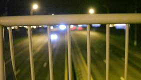 Stock Video Highway traffic night view from the bridge above. Belarus, Minsk, May 7, 2015