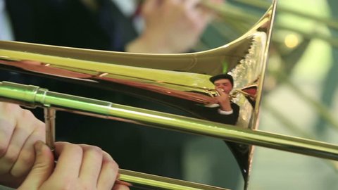 MOSCOW, RUSSIA - MAY 09, 2015: trombones and trumpets. Close-up. Brass Band performing on the stage in the park. Festival marching bands in the city park "Muzeon."